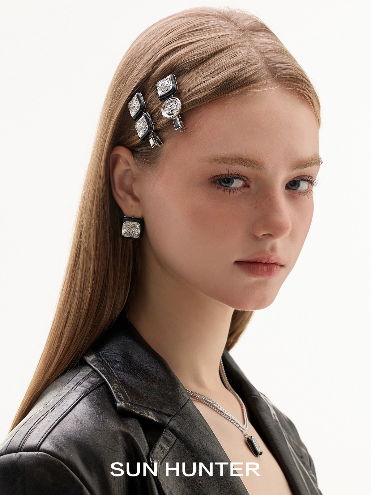 Model wearing SUN HUNTER vintage coin stud earrings with matching accessories for a chic look