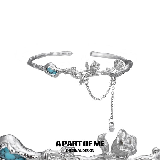 Turquoise flower bracelet by A PART OF ME featuring a silver floral design with intricate details