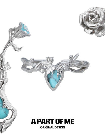 A Part of Me turquoise rose ring in silver, featuring intricate floral designs and a vibrant turquoise stone