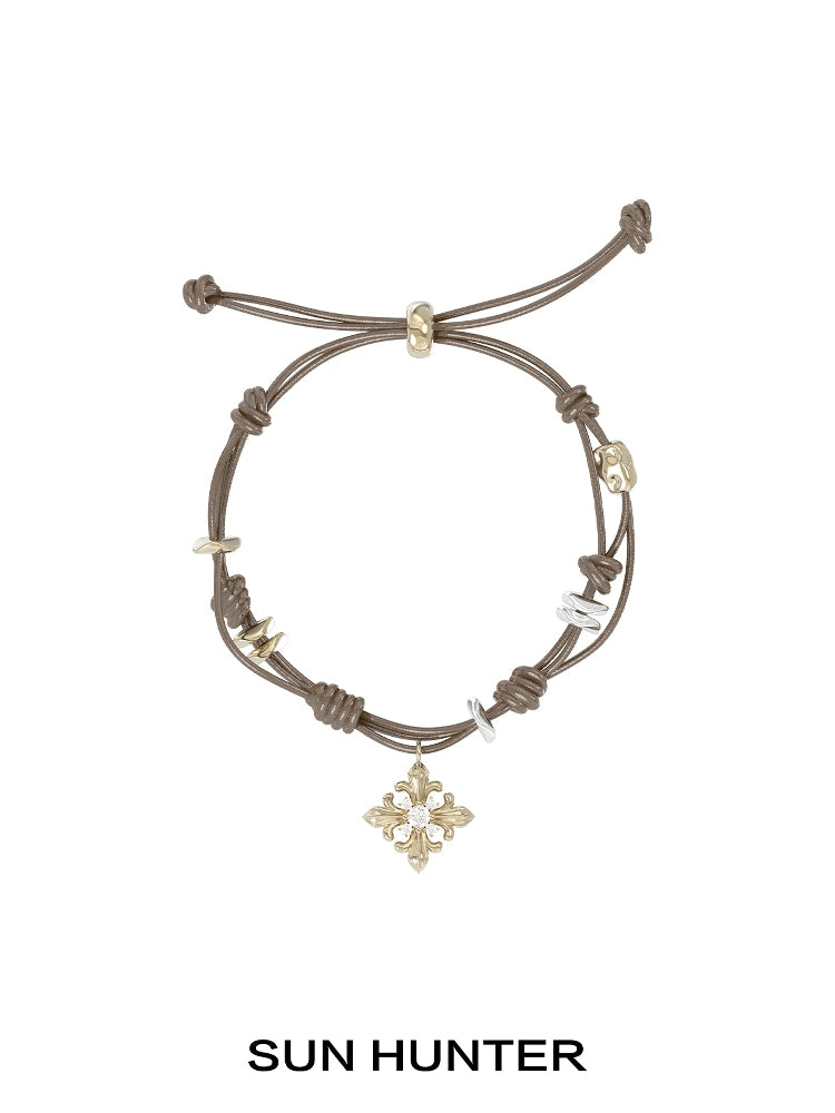 SUN HUNTER Twilight Iris braided bracelet with decorative charms and adjustable closure