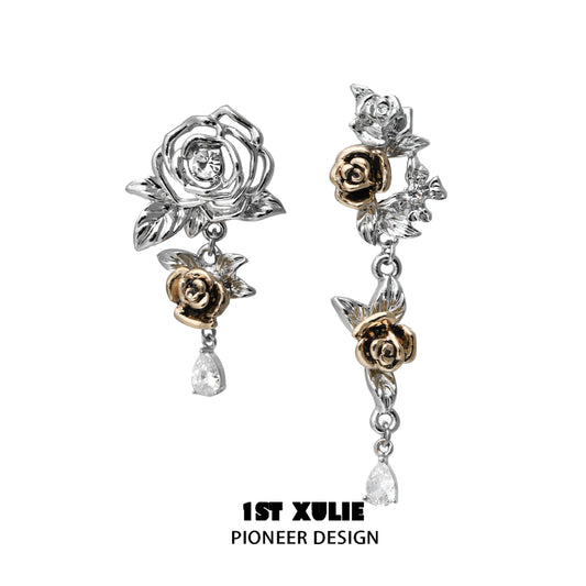Twilight rose punk earrings featuring silver and gold floral designs with dangling crystals