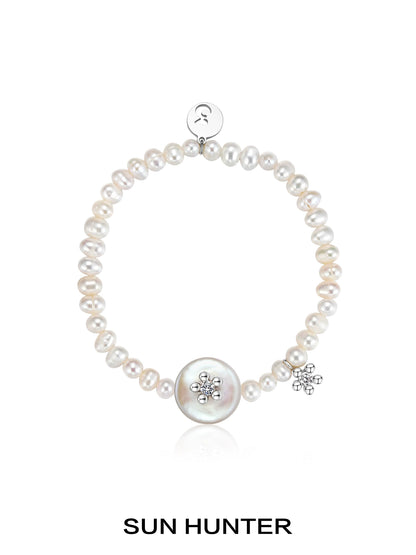 SUN HUNTER unique pearl bracelet featuring a large centerpiece and sparkling accents
