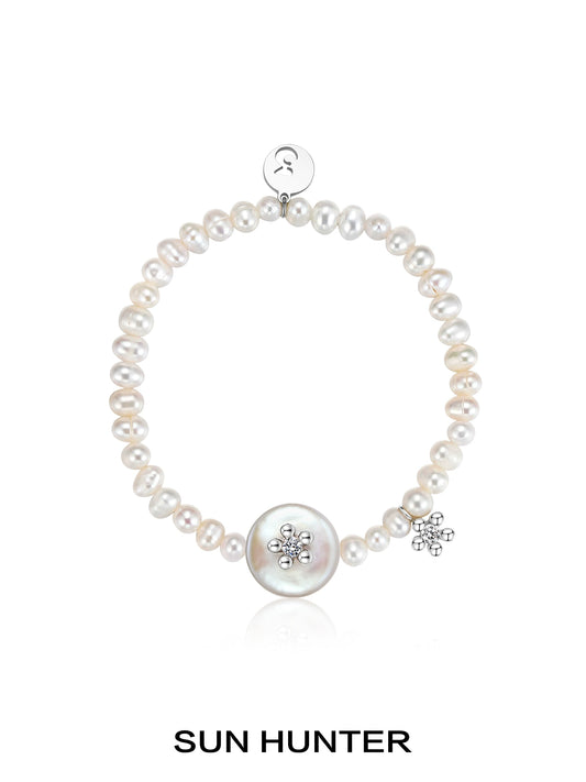SUN HUNTER unique pearl bracelet featuring a large centerpiece and sparkling accents