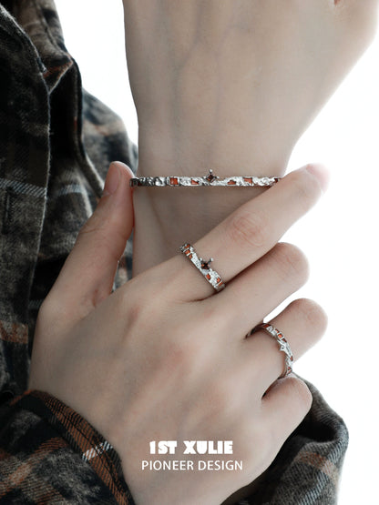 Unique silver bracelet for women worn on a hand, featuring an elegant design with subtle details