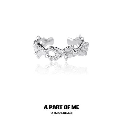 Unique silver ring by A PART OF ME featuring an artistic design with textured details
