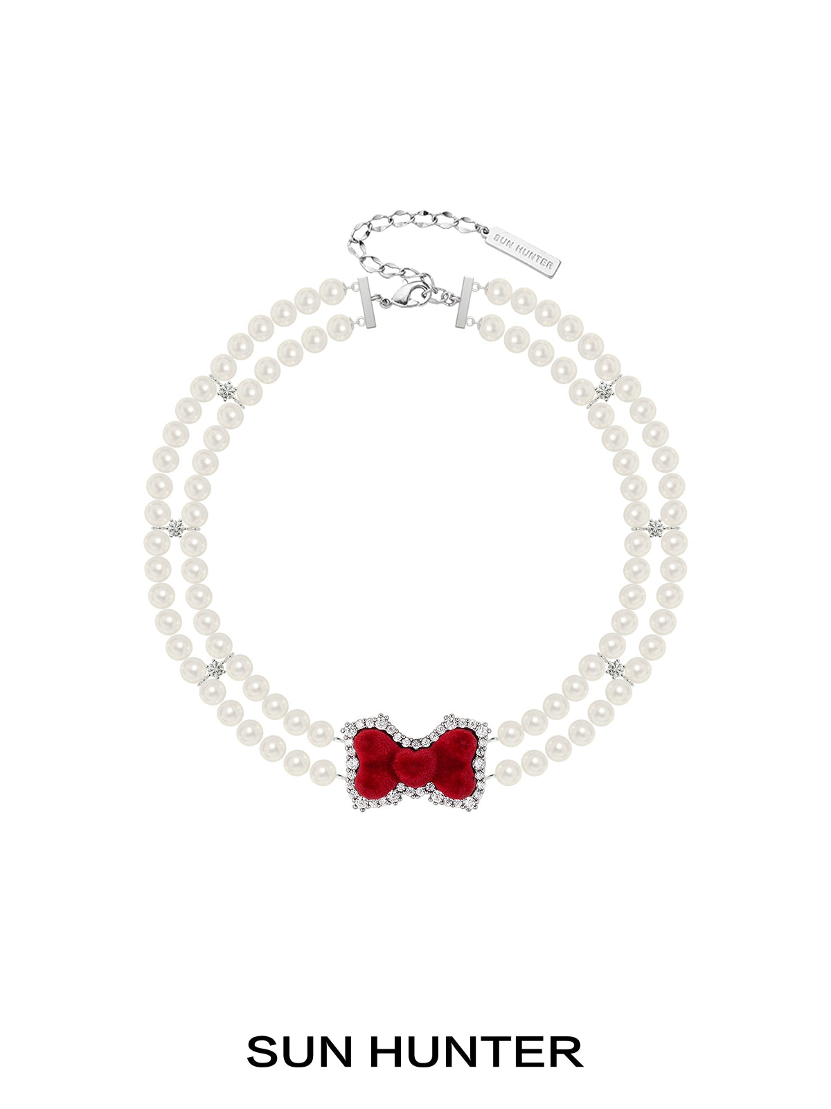 Elegant SUN HUNTER velvet bow pearl bracelet featuring a red bow and pearl beads