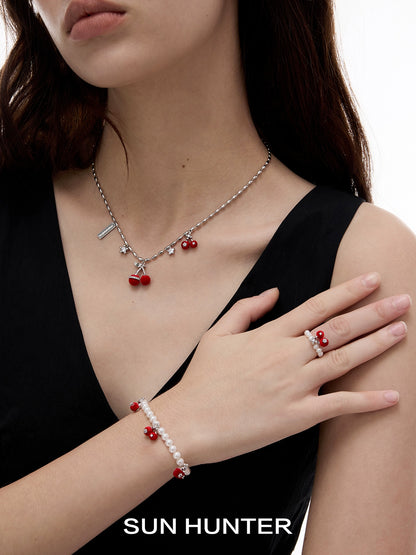 Elegant velvet cherry pearl bracelet from SUN HUNTER showcased on a model's wrist