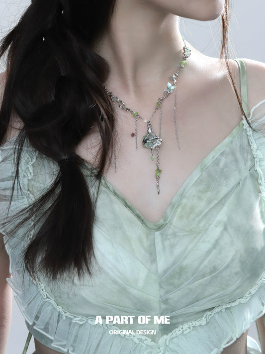 Model showcasing the forest fairy fluorite necklace with intricate design and natural stones