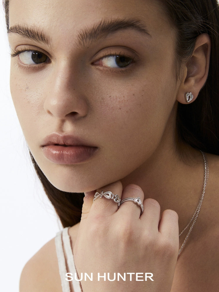 Elegant SUN HUNTER love lock chain ring worn alongside matching jewelry for a complete look