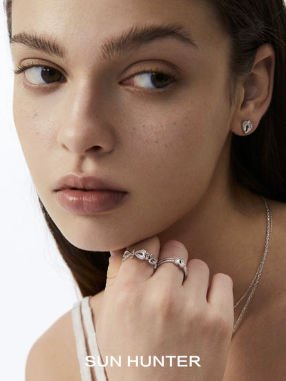 Elegant SUN HUNTER love lock chain ring worn alongside matching jewelry for a complete look