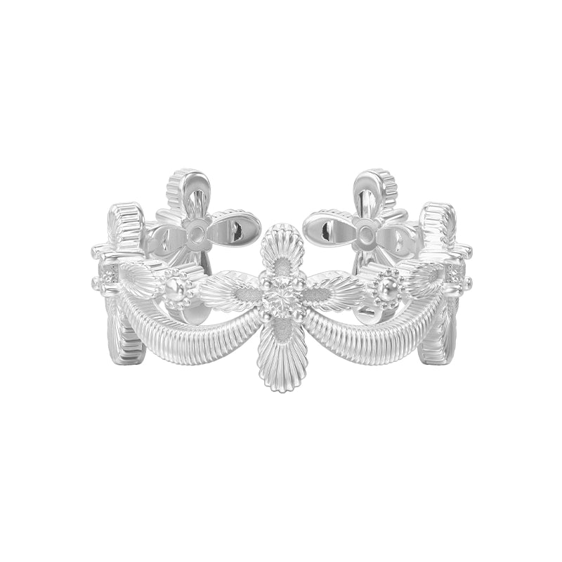 Elegant SUN HUNTER shimmer cross ring in silver with floral design and intricate detailing