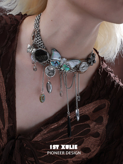 Vintage butterfly necklace featuring intricate design with silver chains and embellishments