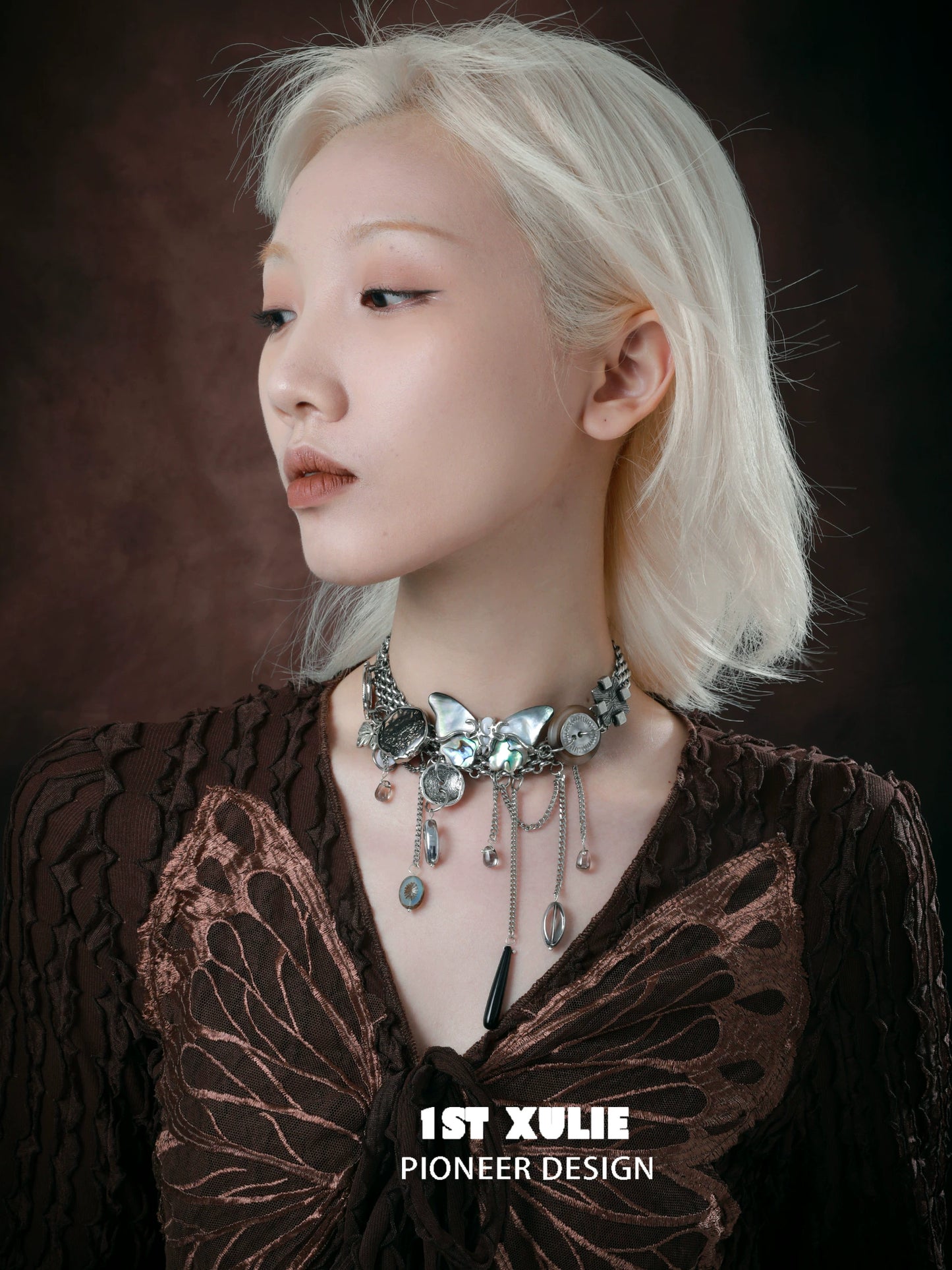 Elegant model showcasing a vintage butterfly necklace with silver accents and detailed design