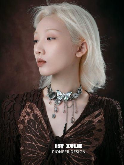 Elegant model showcasing a vintage butterfly necklace with silver accents and detailed design