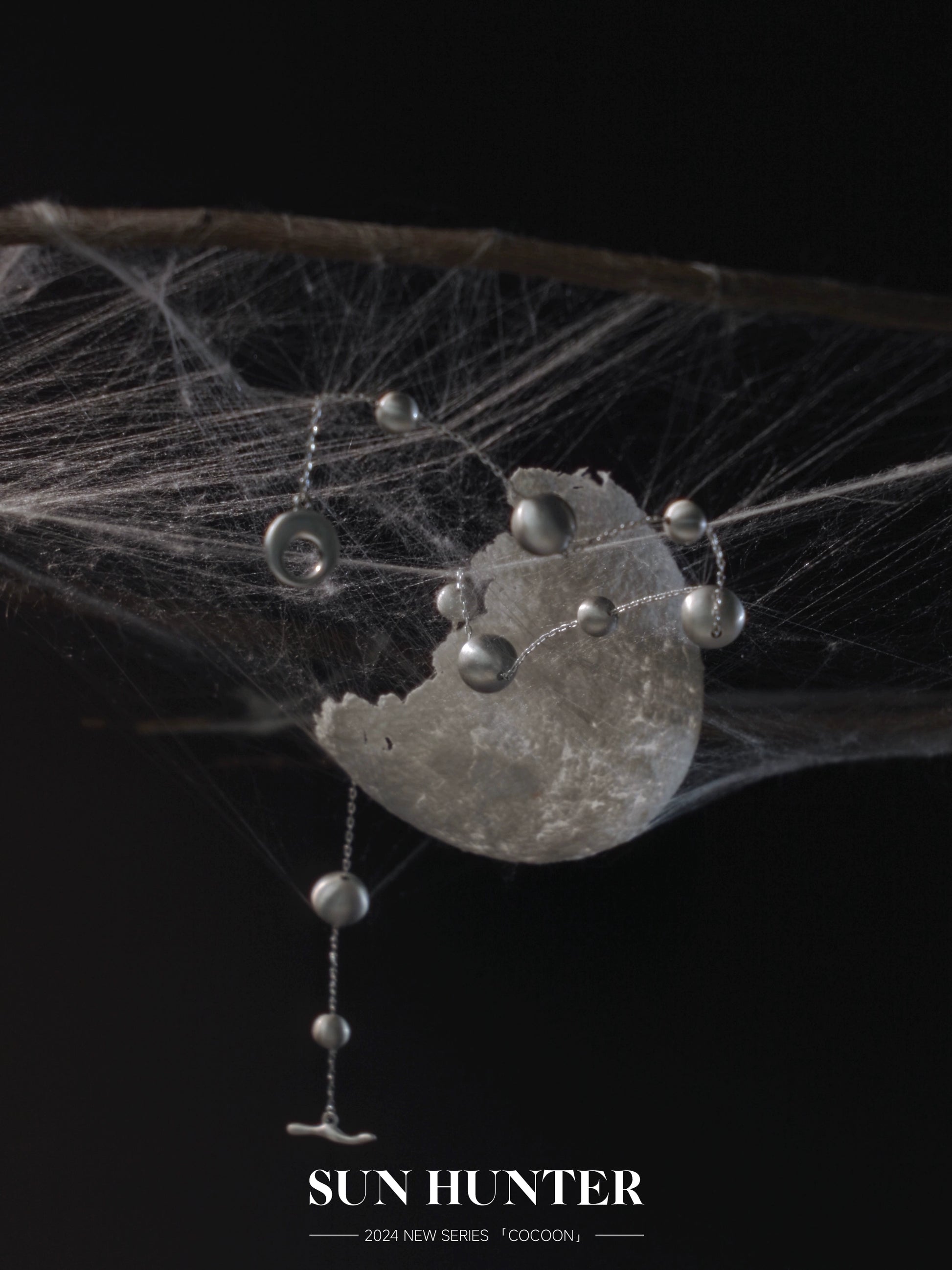 Unique vintage cocoon earrings with delicate design featuring silver accents and a modern aesthetic