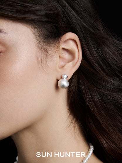 Elegant vintage cocoon earrings by SUN HUNTER, featuring a stylish design perfect for any occasion