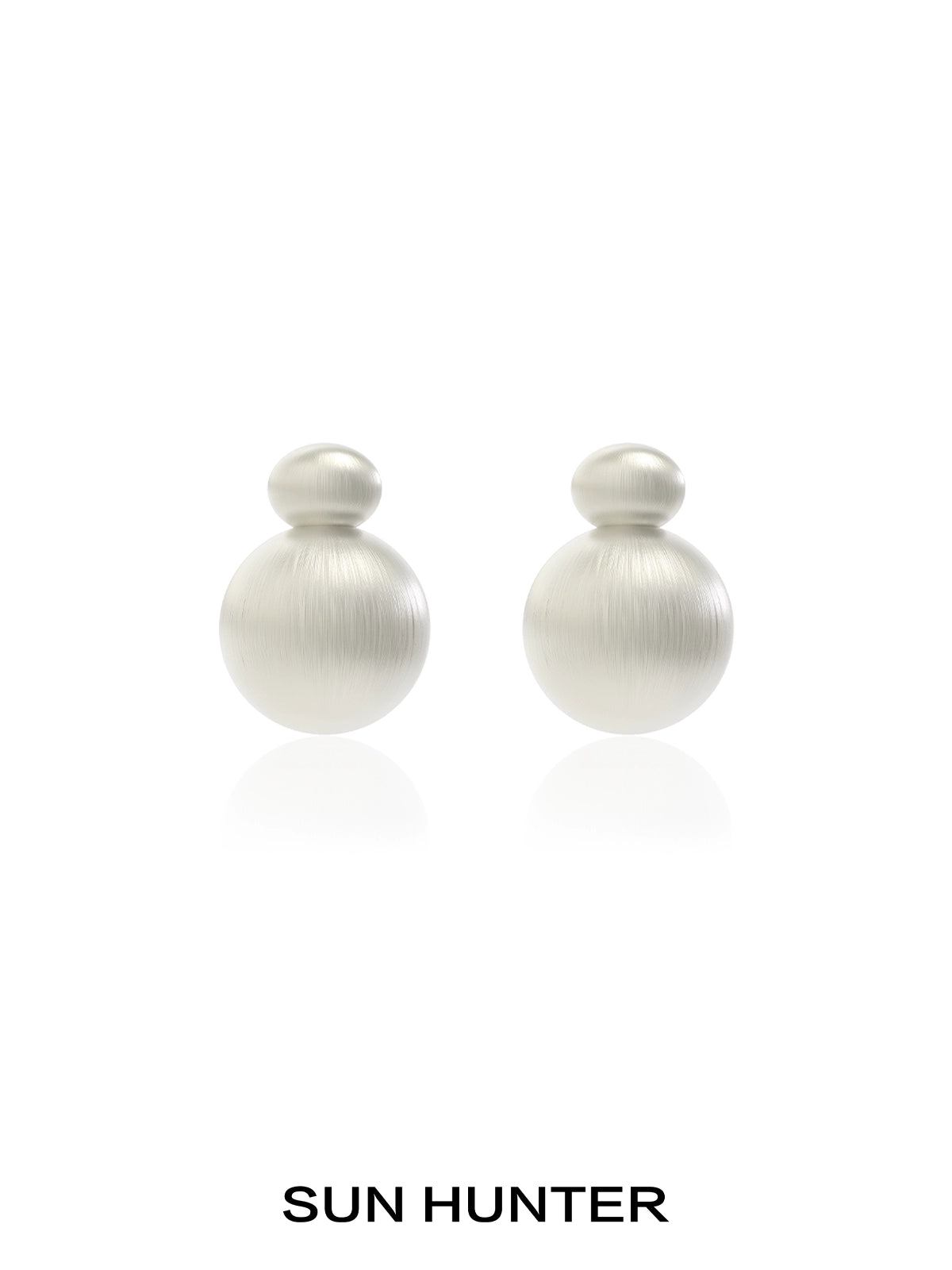Elegant vintage cocoon earrings in soft metallic finish by SUN HUNTER, perfect for any occasion