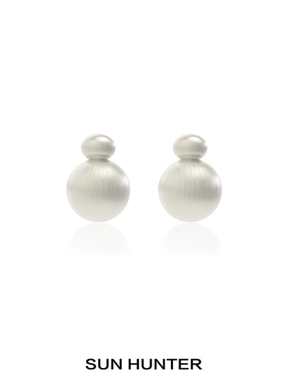 Elegant vintage cocoon earrings in soft metallic finish by SUN HUNTER, perfect for any occasion