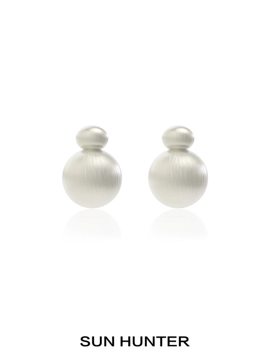 Elegant vintage cocoon earrings in soft metallic finish by SUN HUNTER, perfect for any occasion