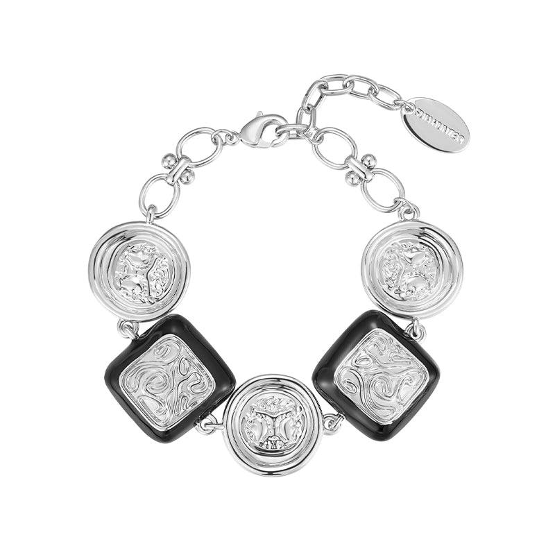 SUN HUNTER vintage coin bracelet with silver detailing and black accents for stylish accessory lovers