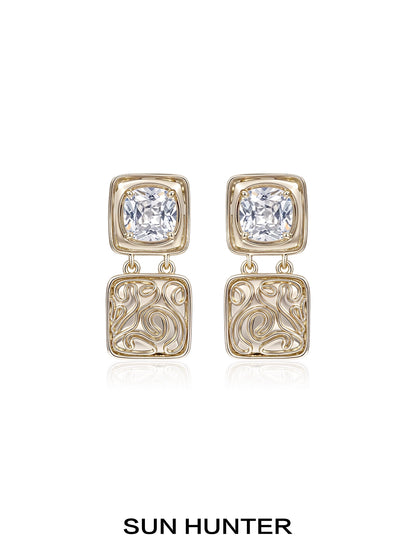 Elegant SUN HUNTER vintage coin earrings with decorative design and sparkling gemstones