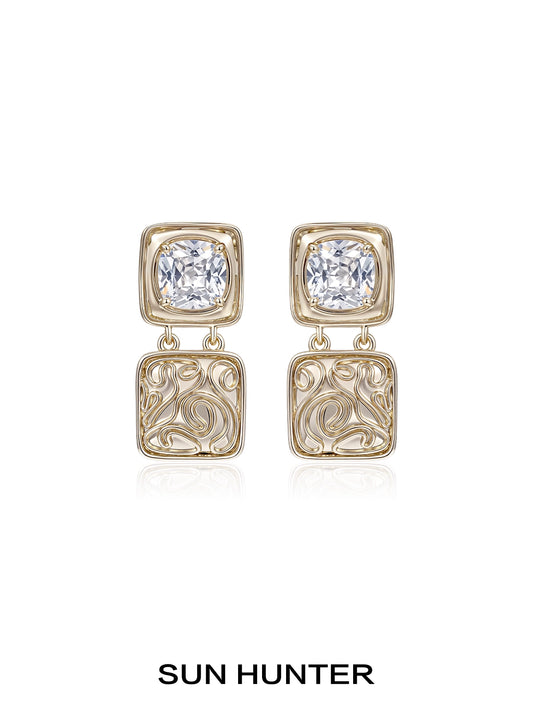 Elegant SUN HUNTER vintage coin earrings with decorative design and sparkling gemstones