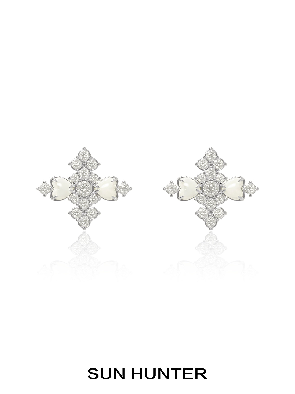 Elegant SUN HUNTER vintage cross earrings featuring intricate design and sparkling stones