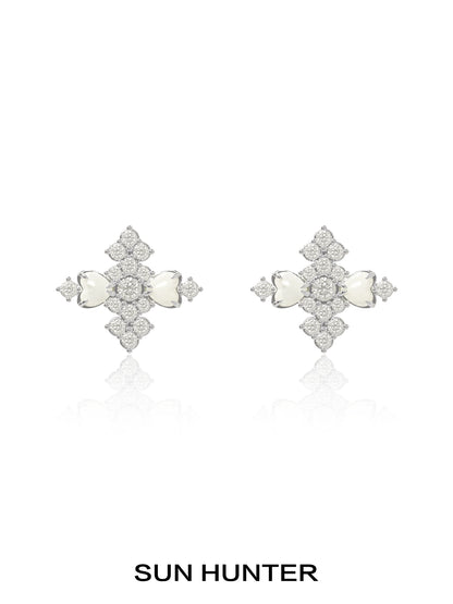 Elegant SUN HUNTER vintage cross earrings featuring intricate design and sparkling stones
