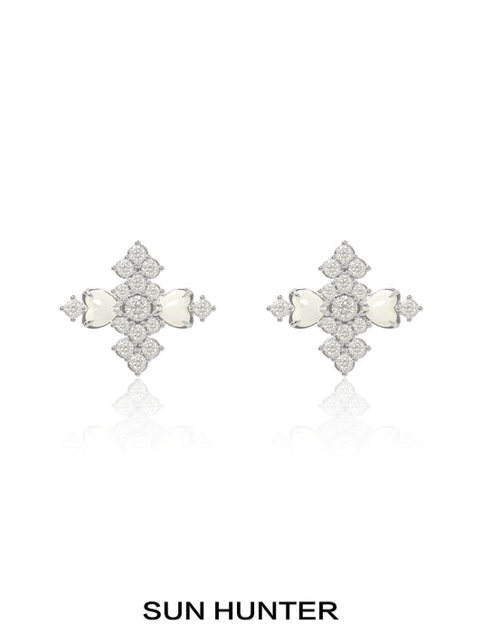 Elegant SUN HUNTER vintage cross earrings featuring intricate design and sparkling stones