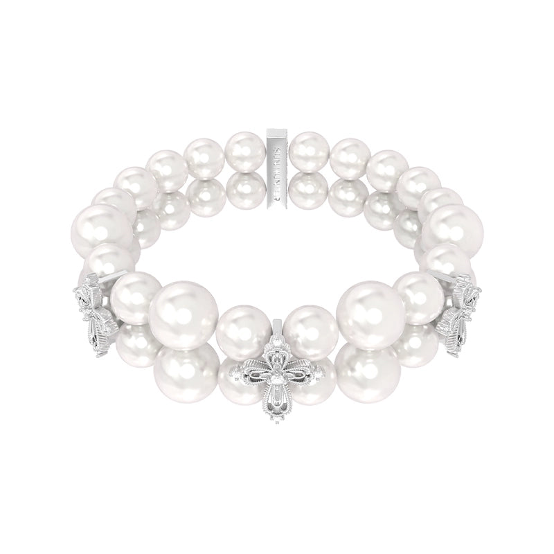 Elegant vintage cross pearl bracelet featuring lustrous pearls and intricate cross embellishments