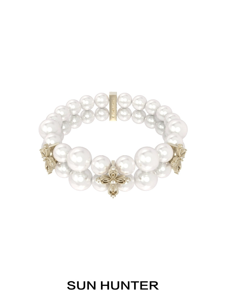 SUN HUNTER vintage cross pearl bracelet featuring elegant faux pearls and intricate cross designs