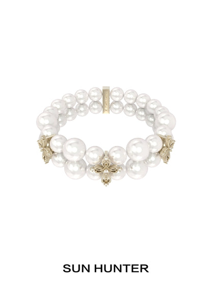 SUN HUNTER vintage cross pearl bracelet featuring elegant faux pearls and intricate cross designs