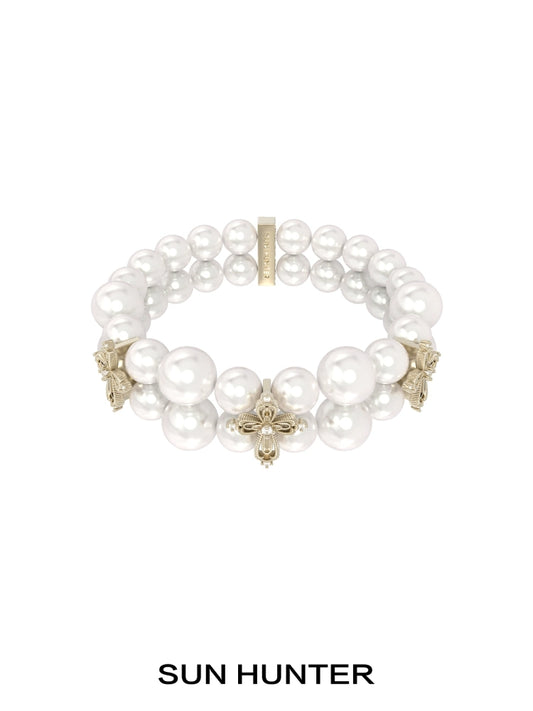 SUN HUNTER vintage cross pearl bracelet featuring elegant faux pearls and intricate cross designs