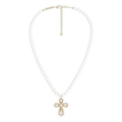Vintage cross pearl necklace featuring a decorative cross pendant on a pearl strand