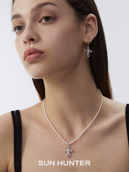 Elegant SUN HUNTER vintage cross pearl necklace paired with matching earrings for a timeless look