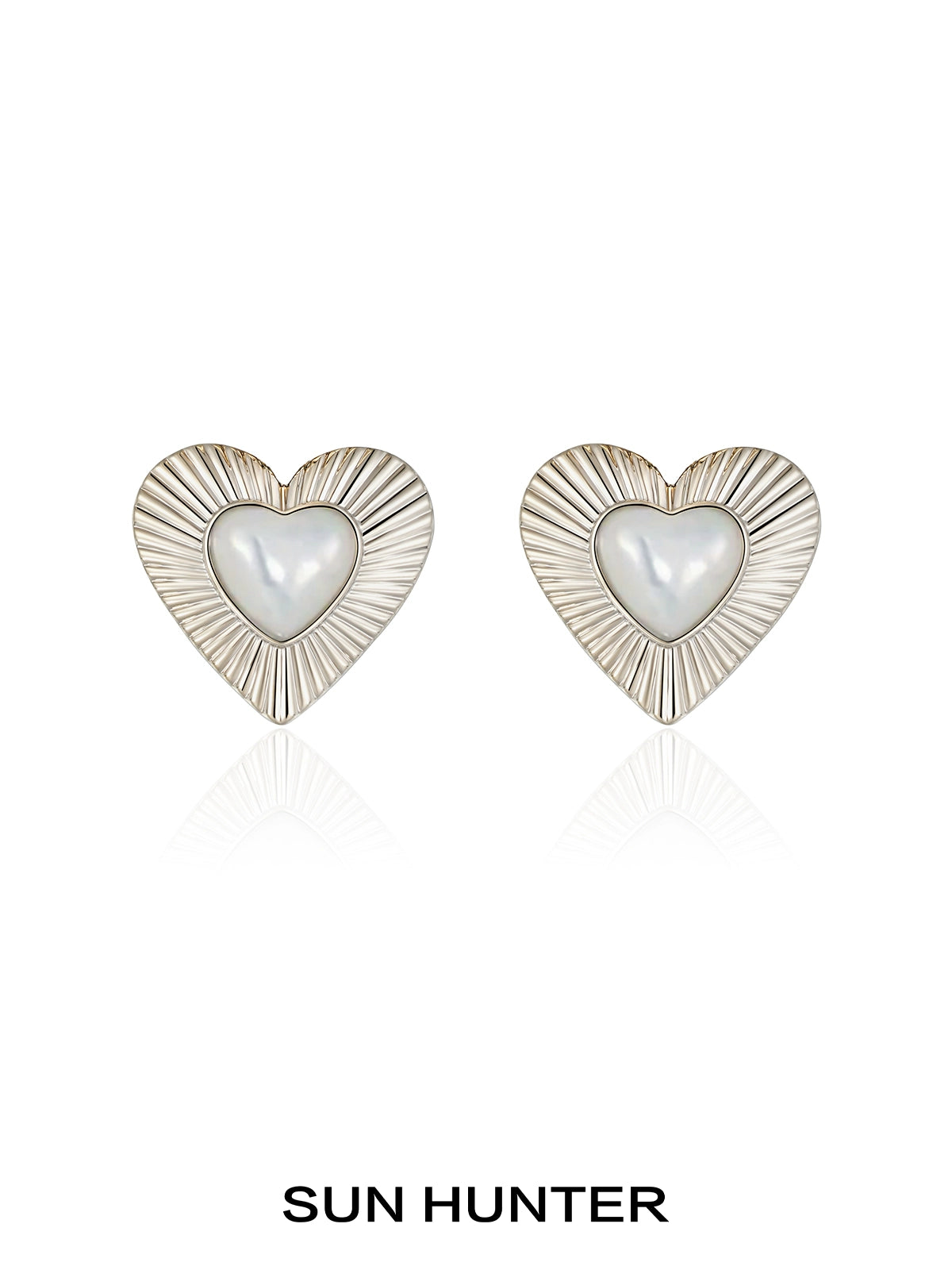 SUN HUNTER vintage heart stud earrings with a pearl center and textured silver design