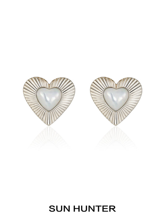 SUN HUNTER vintage heart stud earrings with a pearl center and textured silver design