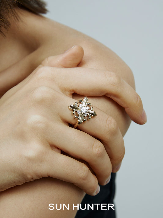 Elegant vintage iris square ring by SUN HUNTER showcasing intricate floral design set on a hand model