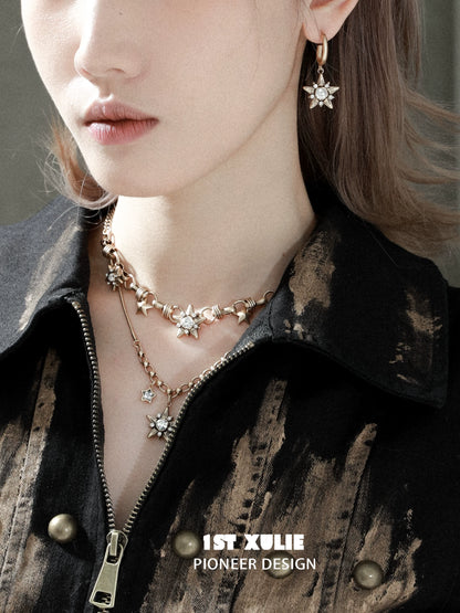 Elegant vintage starlight pendant necklace displayed with matching earrings for a chic look