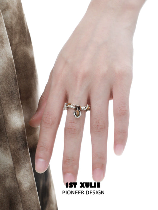 Vintage tiger's eye silver ring showcased on a hand with delicate detailing and gemstone