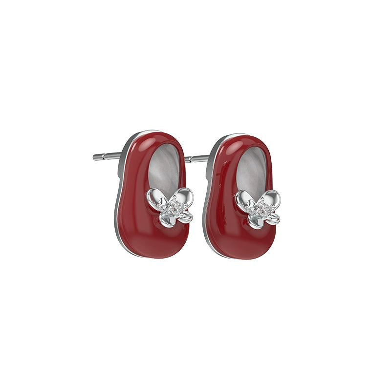 Red vintage walking shoe earrings with flower accents and silver detailing for stylish accessory lovers