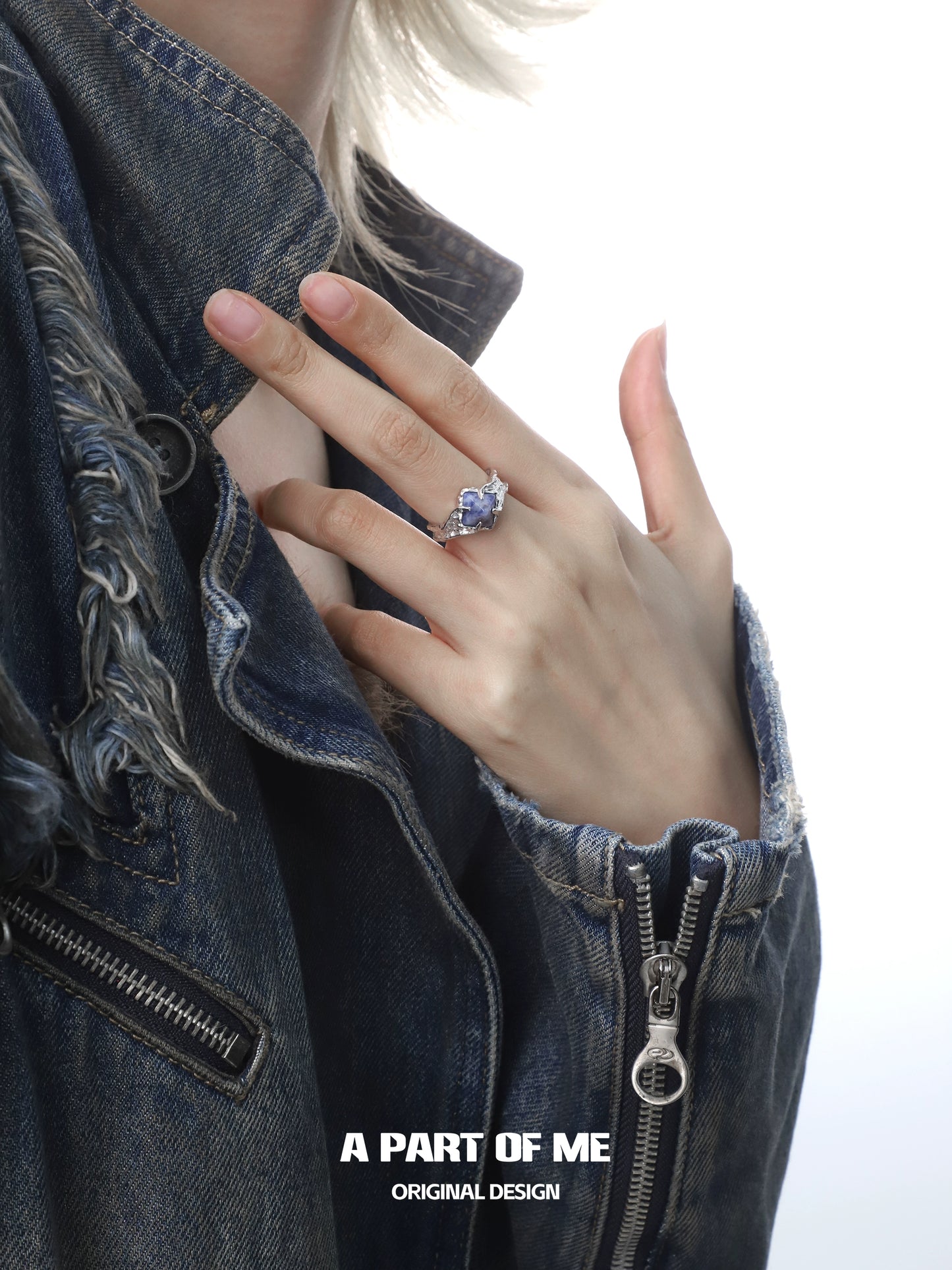 A PART OF ME violet gemstone ring showcased on a hand with a denim jacket