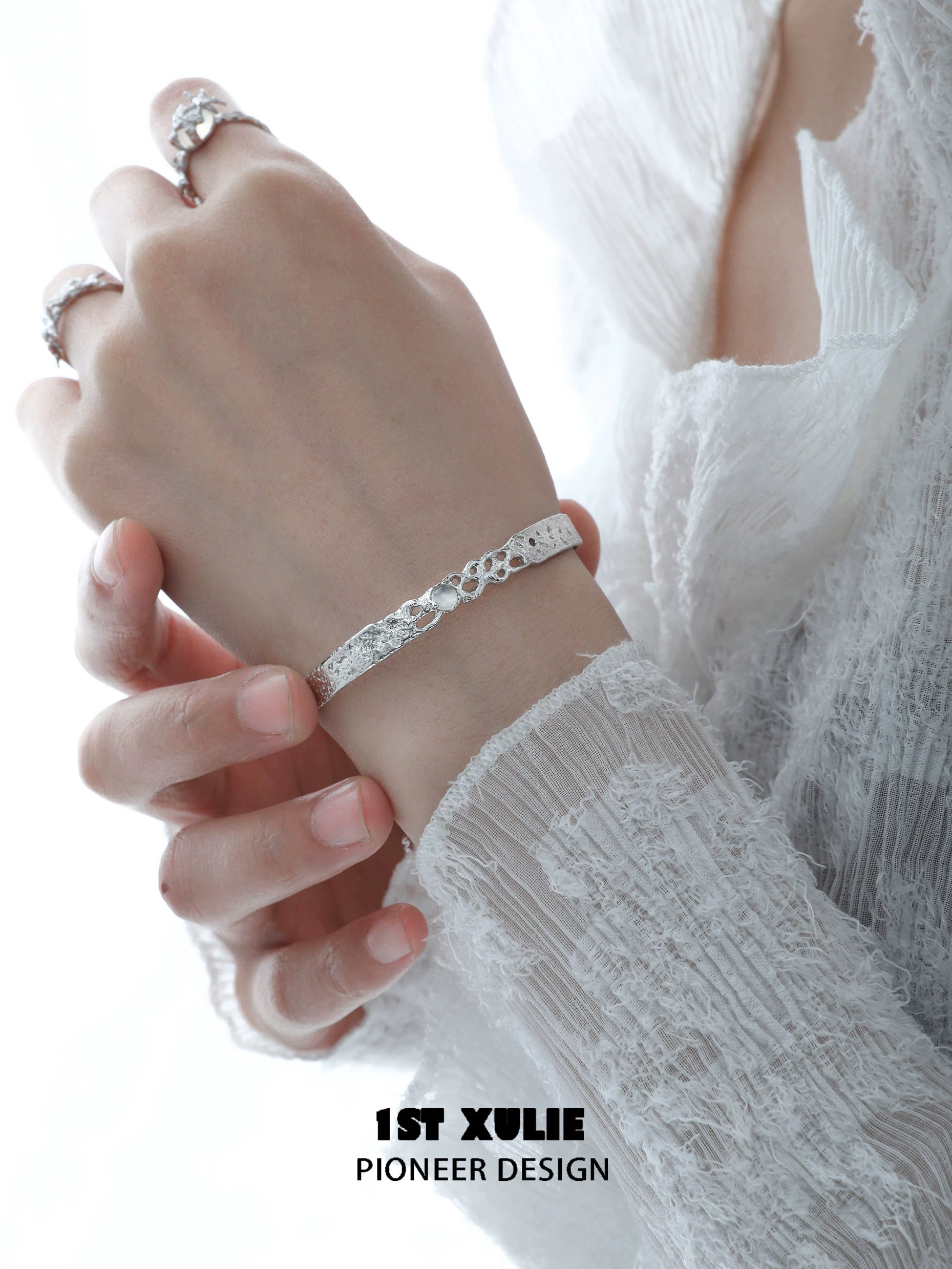 Elegant white agate bangle bracelet worn on a delicate hand for a stylish look
