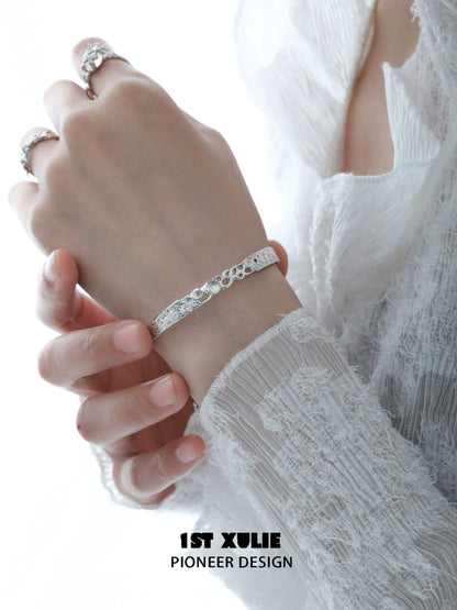 Elegant white agate bangle bracelet worn on a delicate hand for a stylish look