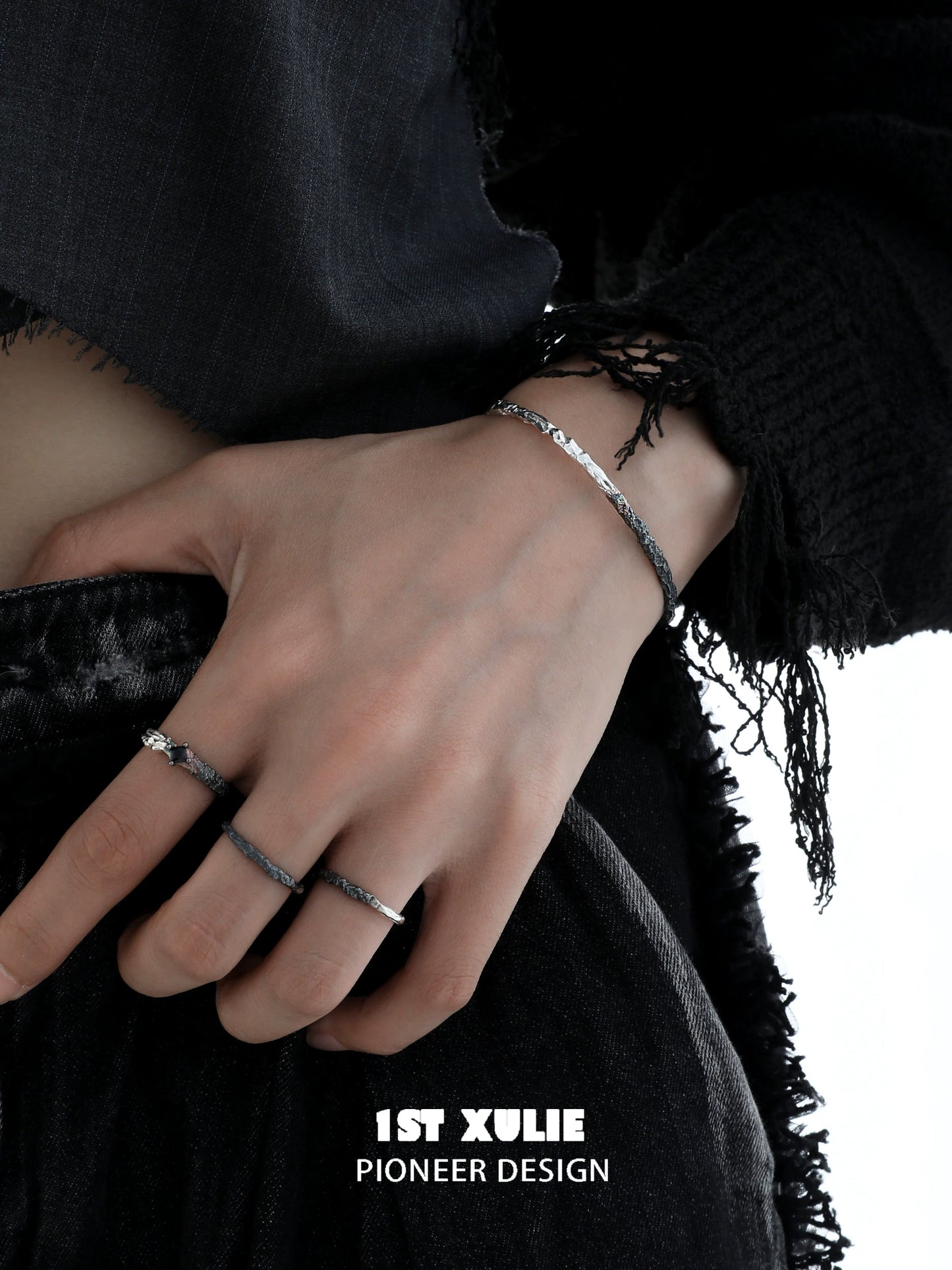 Stylish Y2K black and white couple bracelet worn on wrist, showcasing a trendy design and textured detail.