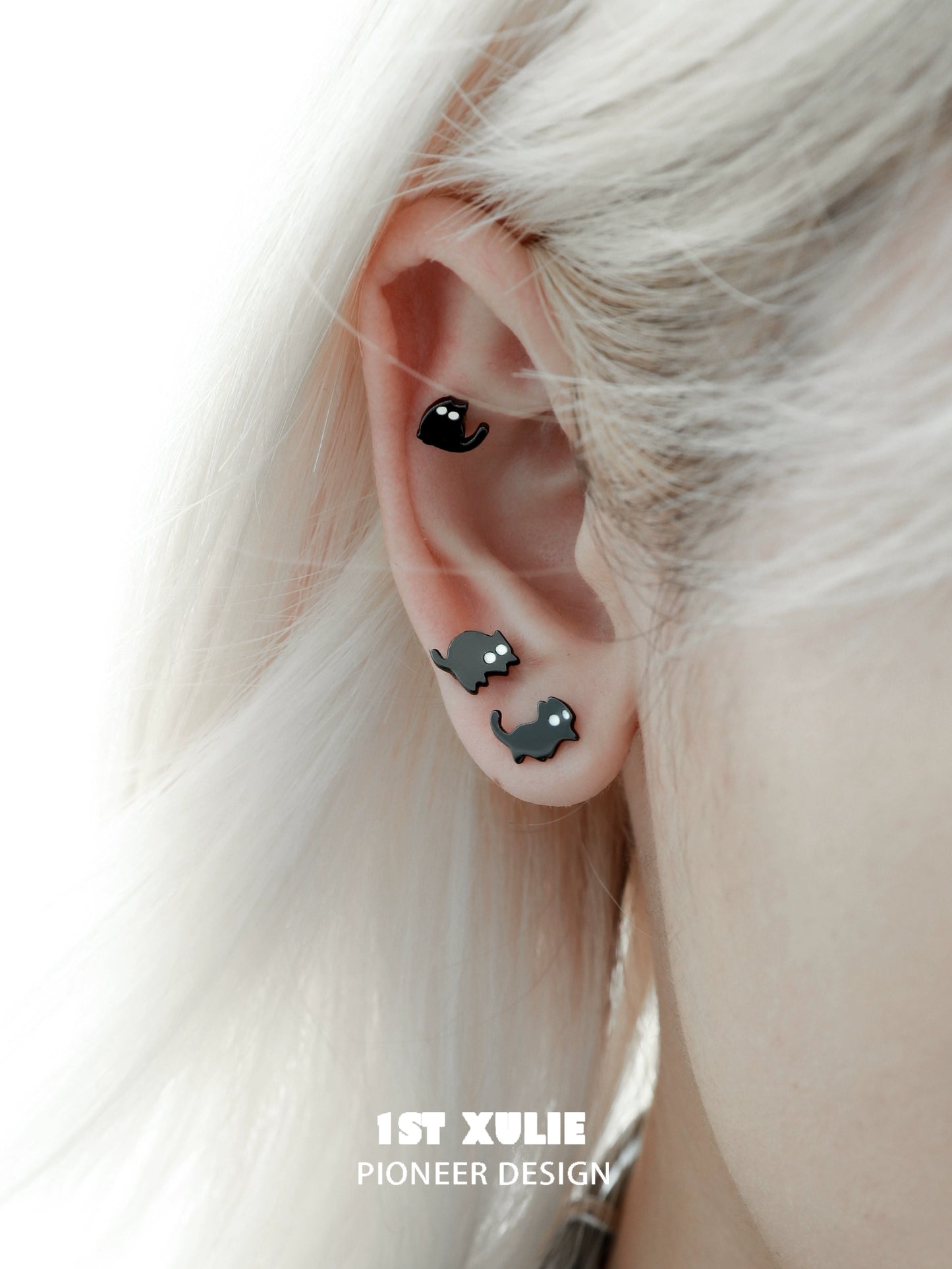 Y2K black cat earrings stylishly displayed on a model's ear with a trendy hairstyle