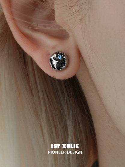 Y2K black silver stud earrings featuring a unique textured design and blue accents