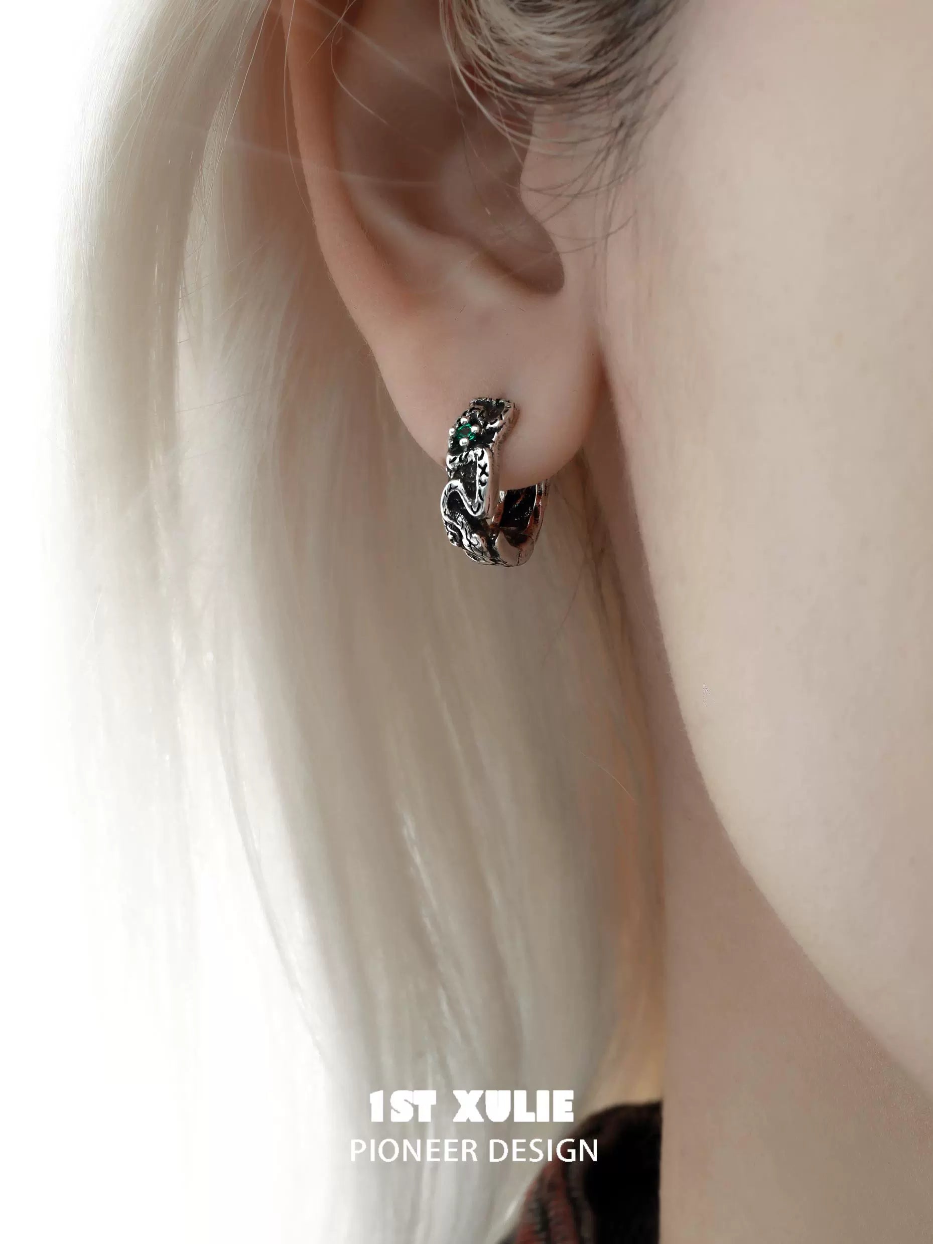 Y2K black snake earrings displayed on a model's ear for a stylish look