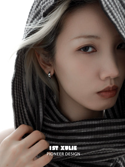 Y2K butterfly earrings showcased on a model with a stylish gray scarf
