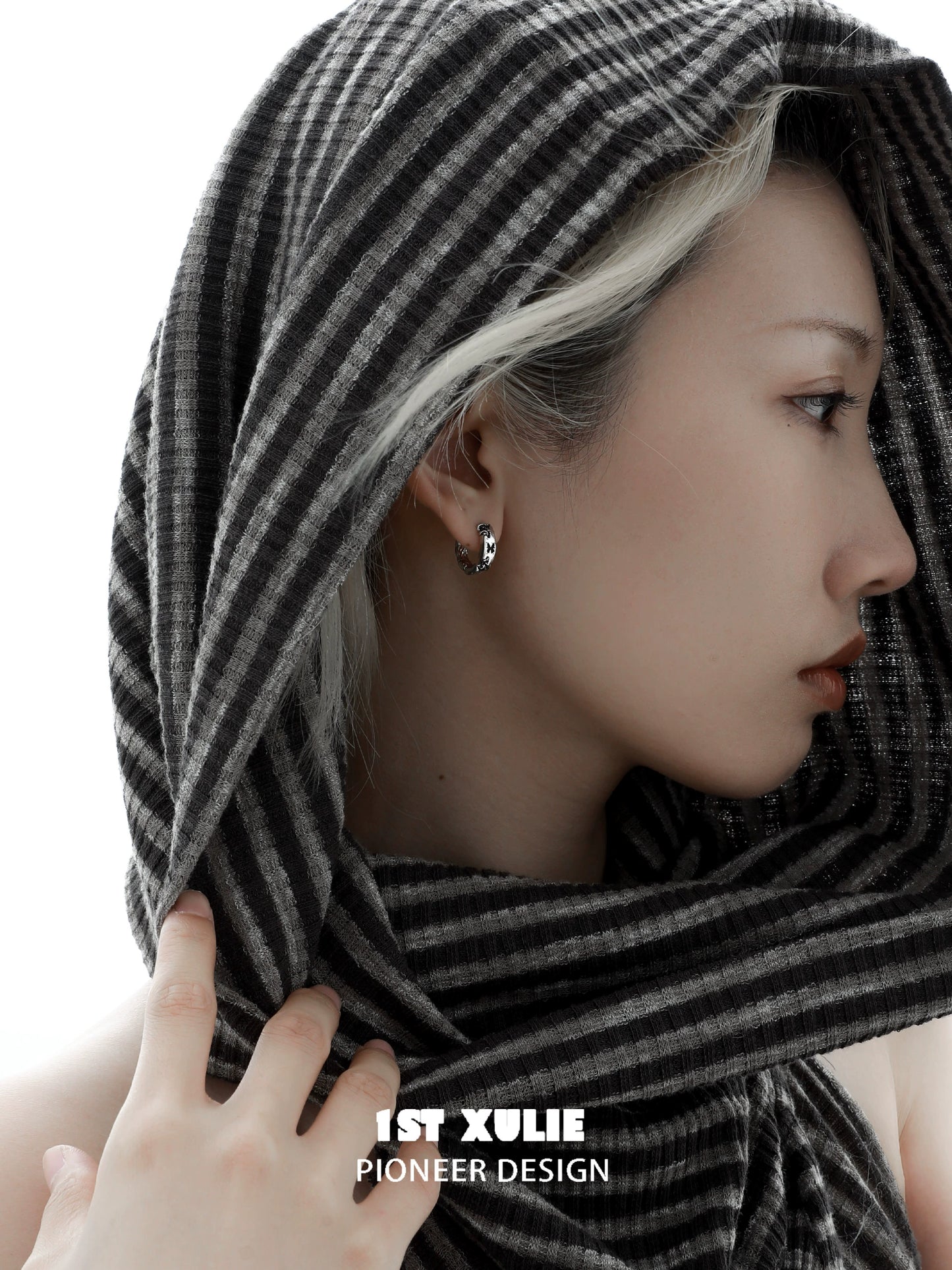 Y2K butterfly earrings showcased on a model wearing a striped scarf